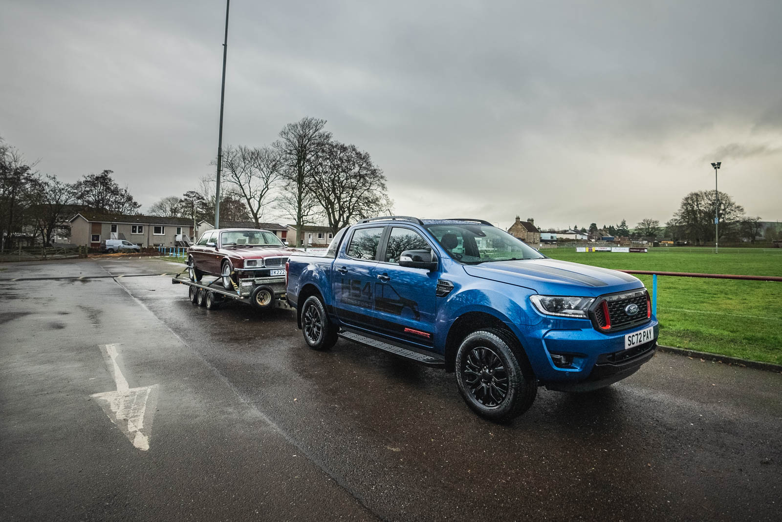 HS4 Transport blue Ford Ranger with trailer carrying a classic car