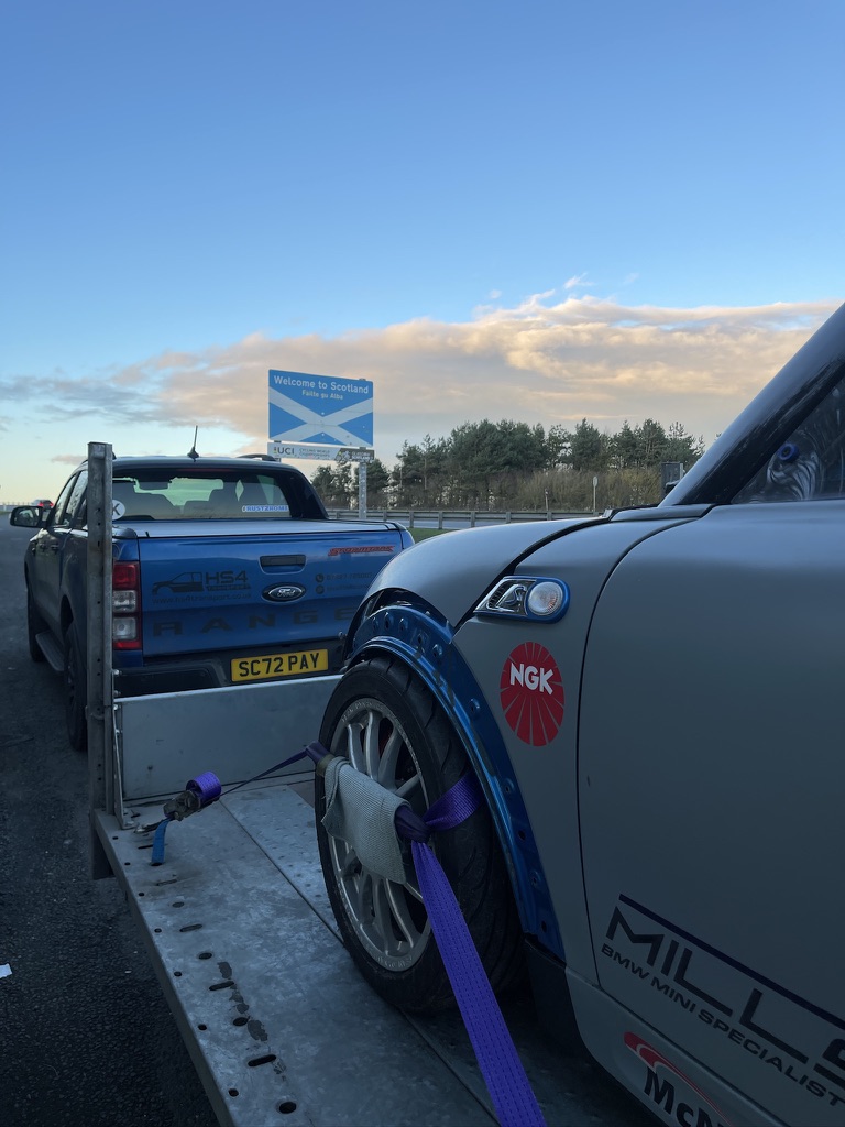 Performance car carefully secured to the trailer